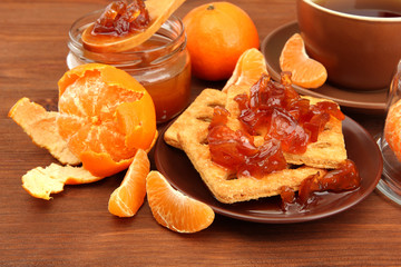 light breakfast with tea and homemade jam, on wooden table