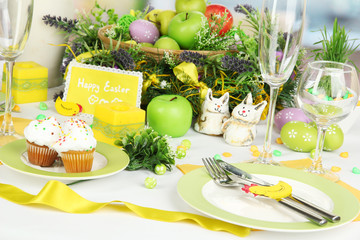 Serving Easter table on room background
