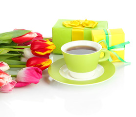 Beautiful tulips in bucket with gifts and cup of tea isolated
