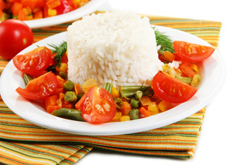 Delicious risotto with vegetables isolated on white