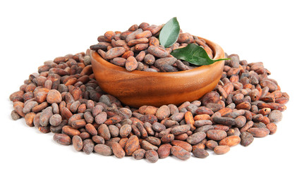 Cocoa beans in bowl with leaves, isolated on white