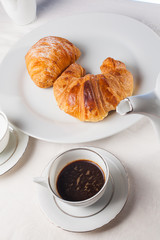 Coffee serrved with croissant and sfogliatella(typical Napoli sw