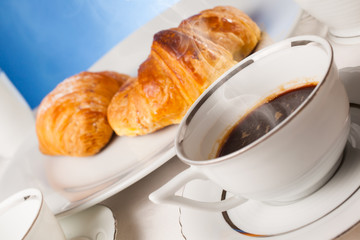 Coffee serrved with croissant and sfogliatella(typical Napoli sw