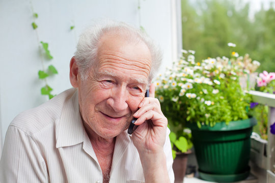 Pleased Senior Speaking On The Phone