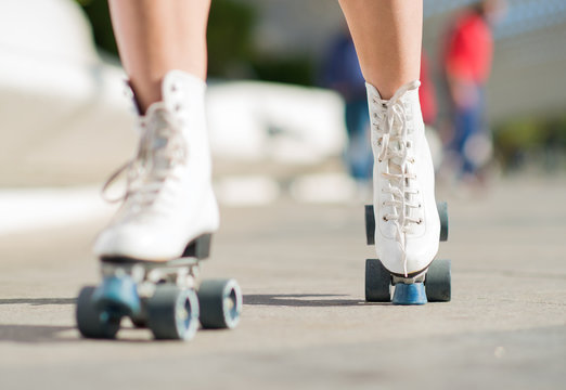 Close-up Of Legs With Roller Skates