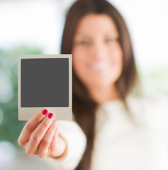 Woman Holding Blank Instant Photo