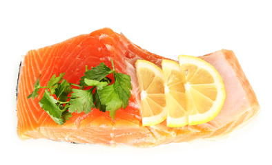 Fresh salmon fillet with herbals and lemon slices, isolated