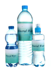 Naklejka premium Different water bottles with label isolated on white