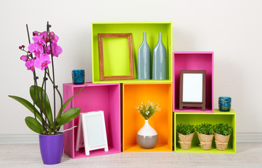 Beautiful colorful shelves with different home related objects