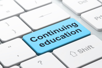 Education concept: Continuing Education on computer keyboard bac
