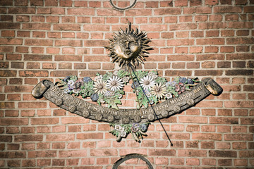 Sundial on brick wall