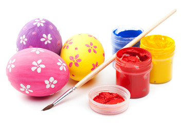 easter eggs with paints and paintbrush on white