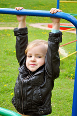 Fototapeta premium The girl on the horizontal bar