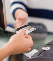 Woman Paying Bill With Credit Card