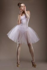 Charming Woman in White Tutu with Pearly Beads over Grey. Ballet