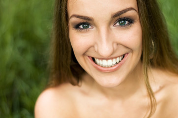 Summer girl portrait. Young woman smiling
