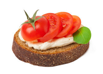 Warm bread tomatoes, cream cheese and basil isolated on white ba