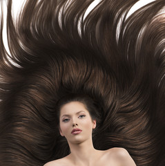 girl with long brown hair and nude shoulders