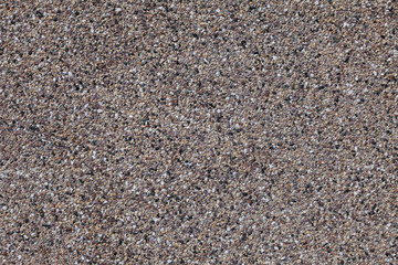 facade surface with mortar composed of tiny multicolored stones