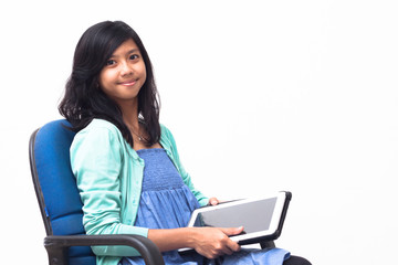 isolated smiling young business woman holding her tablet pc