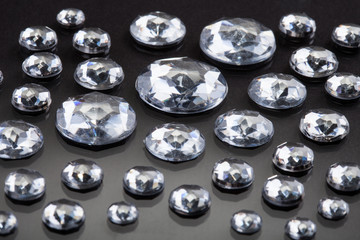 Close-up Of Diamonds Isolated Over Gray Background