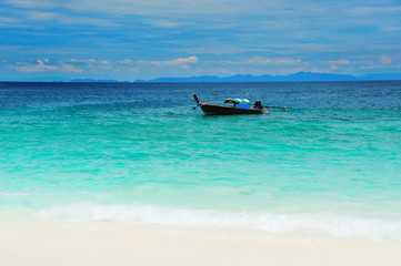 Longtail boat on the sea tropical beach