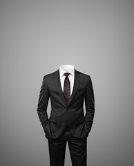 man without head on gray background