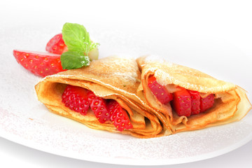 pancakes. crepes with with strawberry on white background