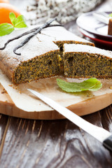 vanilla pie with poppy seeds on a wooden board
