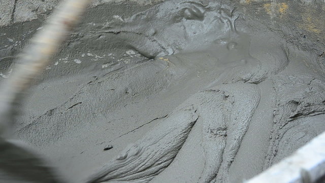 worker is mixing the cement close up