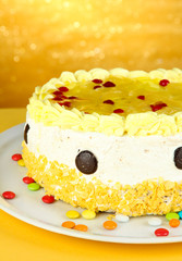 Tasty cake on yellow background