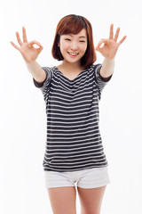 Young Asian student showing okay sign