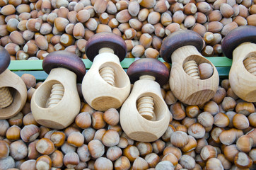 wooden nutcrackers and hazelnuts in market