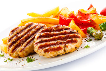 Grilled steak, French fries and vegetables