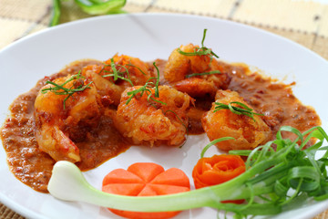 Fried prawn balls in red curry.