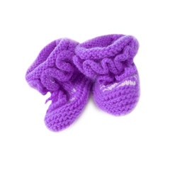 Handmade sweet baby booties isolated on a white