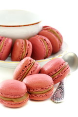 Almond cakes and a cup with teaspoon.
