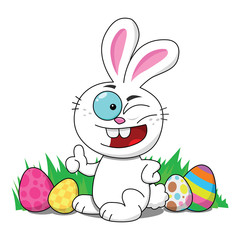 Winking Easter bunny in grass with Easter eggs