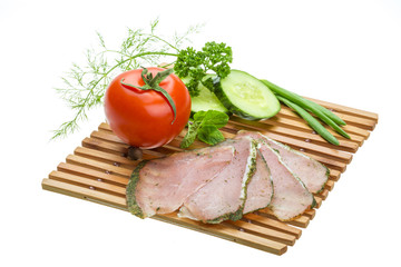 Ripe fresh ham with vegetables