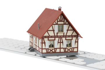 Wohnhaus auf Tastatur