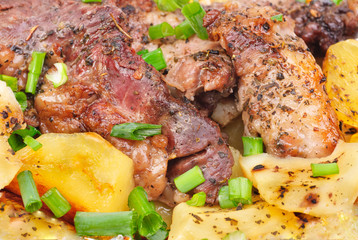 Barbecue meat with potato close-up as food background