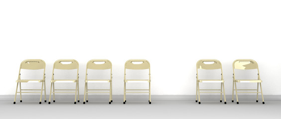 A row of metal chairs against a wall with one missing