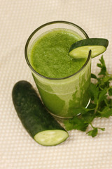 Green vegetable juice on light background