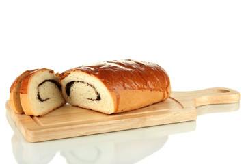 Loaf with poppy seeds on cutting board, isolated on white