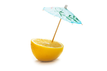 Lemon and umbrella isolated on the white