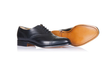 Naklejka premium Fashion concept with male shoes on white