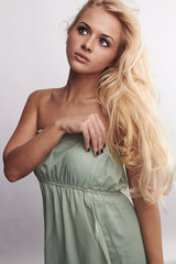 beautiful tender blond woman in dress