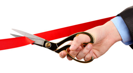 Cutting red ribbon, isolated on white