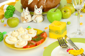 Serving Easter table with tasty dishes close-up