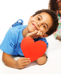 Cute five years old boy with heart symbol
